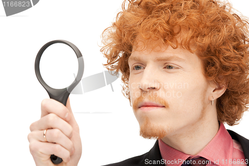 Image of man with magnifying glass