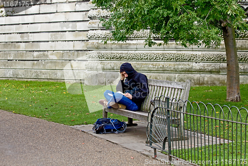 Image of Student on London park bench