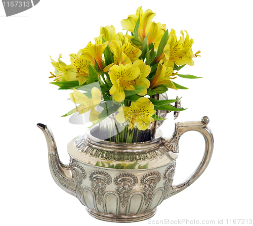 Image of Silver Teapot with Bunch  of Yellow Flowers 