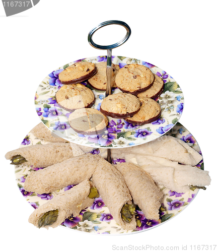 Image of Retro Plates with Chocolate Biscuits and Asparagus Rolls