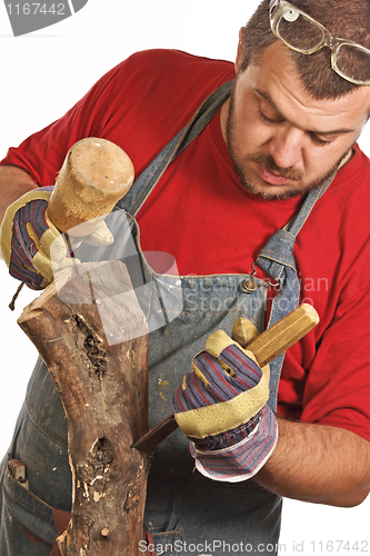 Image of man and sculpture making