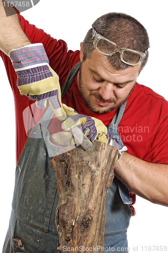 Image of man sculptor and his wood