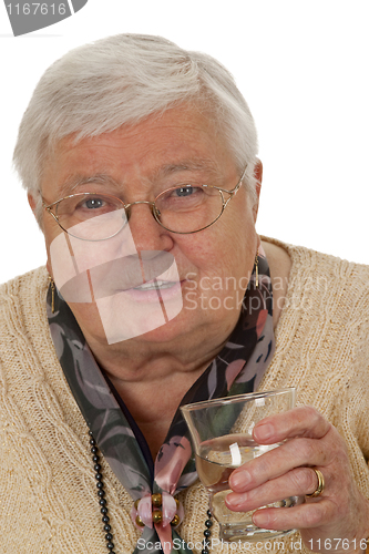 Image of Senior woman drinking water