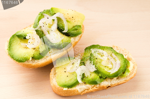 Image of Sandwich with avocado on a wooden board 