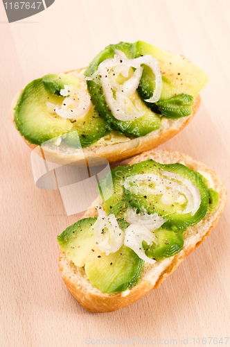 Image of Sandwich with avocado on a wooden board 