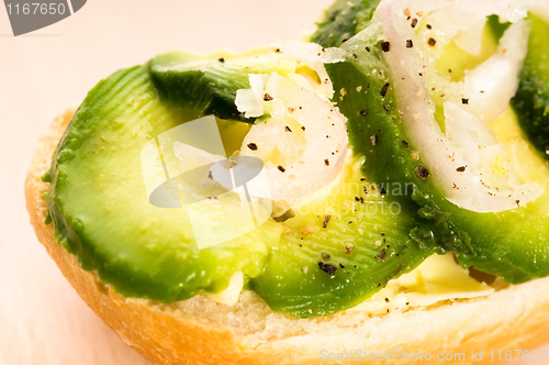 Image of Sandwich with avocado on a wooden board 