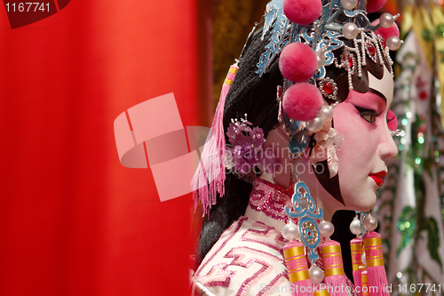 Image of chinese opera dummy and red cloth as text space ,it is a toy,not