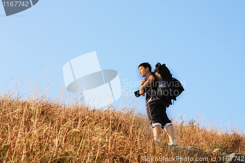 Image of Sport hiking in mountains, walking and backpacking 