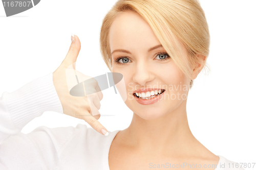Image of woman making a call me gesture