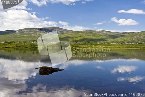Image of Calm lake and blue sky