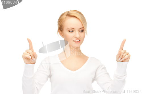 Image of businesswoman working with something imaginary