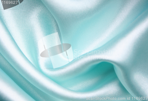 Image of Smooth elegant blue silk as background 