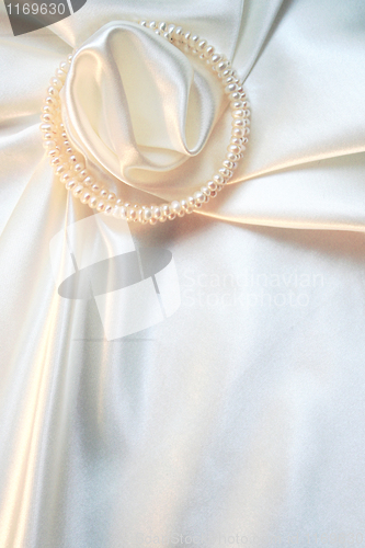 Image of Smooth elegant white silk with pearls as wedding background 