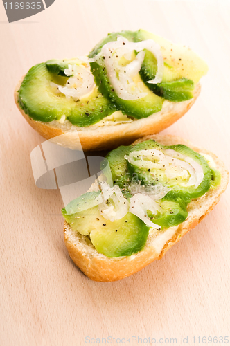 Image of Sandwich with avocado on a wooden board 