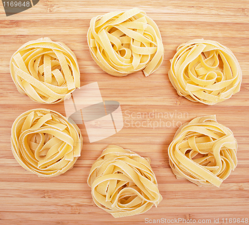 Image of Tagliatelle on the wooden background