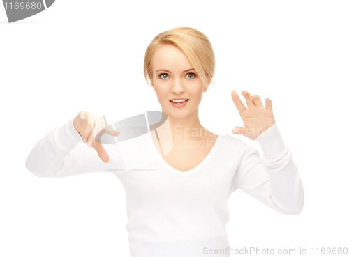 Image of businesswoman working with something imaginary