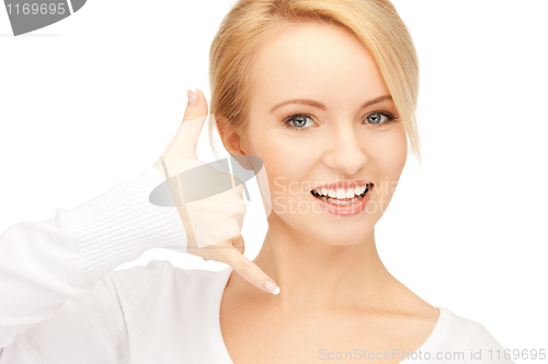 Image of woman making a call me gesture