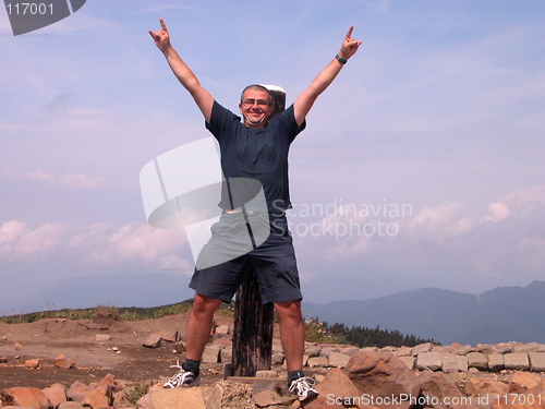 Image of Happy man in the mountain top