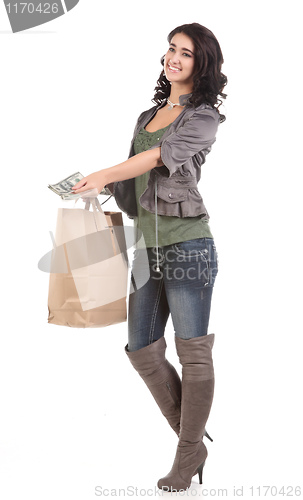 Image of young woman with shopping and cash