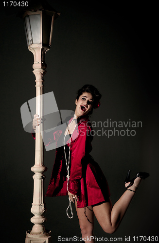Image of young woman and lightpole