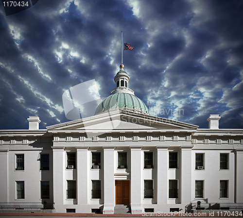 Image of US flag at half mast on courthouse