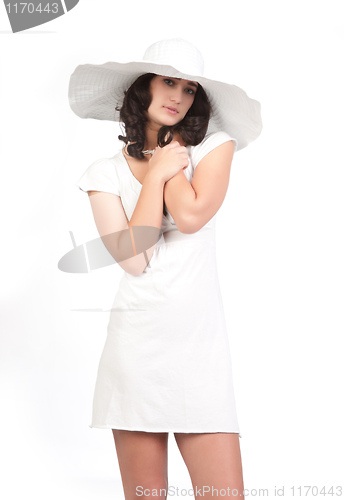 Image of young woman in white dress and hat