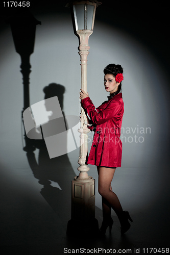 Image of young woman and lightpole