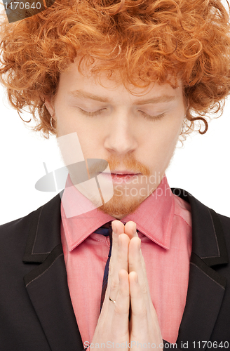 Image of praying businessman