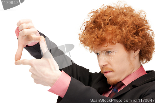 Image of handsome man creating a frame with fingers