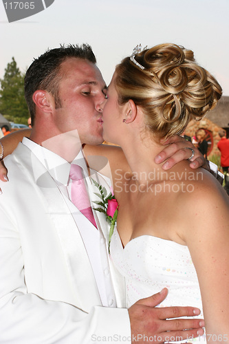 Image of Wedding Couple kissing