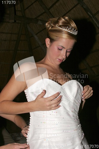 Image of Wedding Bride getting dressed