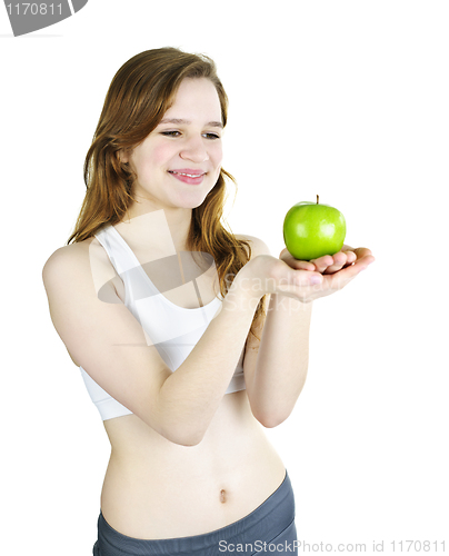 Image of Young smiling girl holding apple