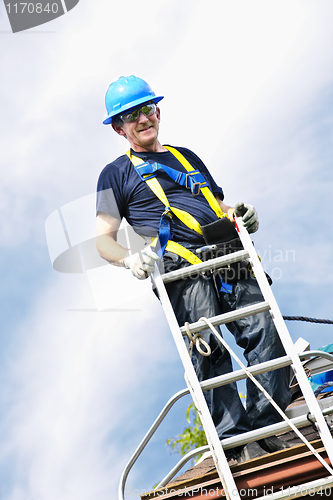 Image of Man working on roof