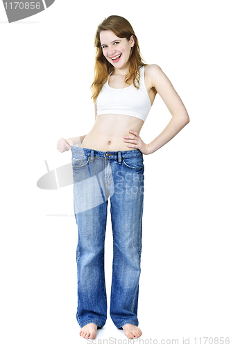 Image of Happy girl in jeans after losing weight