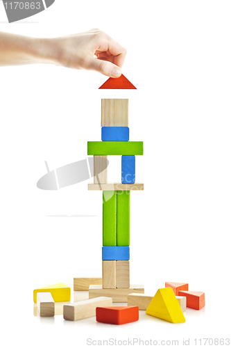 Image of Wooden block tower under construction