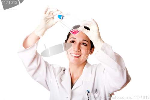 Image of Female scientist looking at tissue culture flask