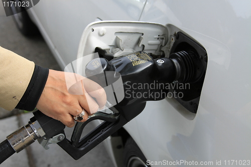 Image of Person Pumping Gas