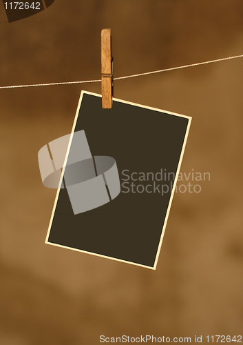 Image of  photo on metal rope with wood Clothespins 