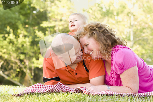 Image of Affectionate Couple with Son in Park