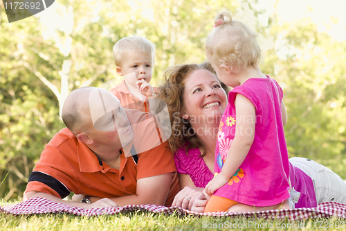 Image of Happy Young Family with Cute Twins in Park