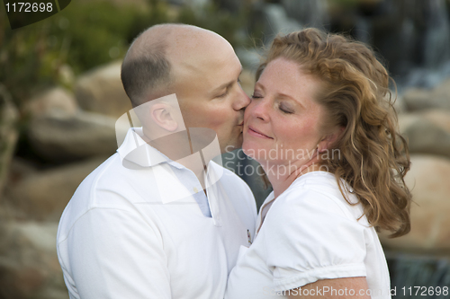 Image of Attractive Couple Pose for Portrait in the Park.