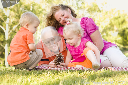 Image of Young Family Enjoying The Park Together