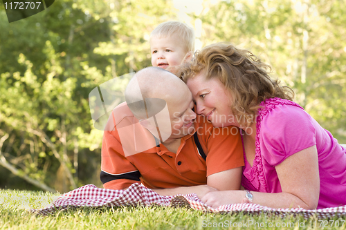 Image of Affectionate Couple with Son in Park