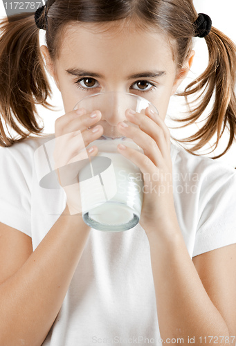 Image of Little girl drinking milk