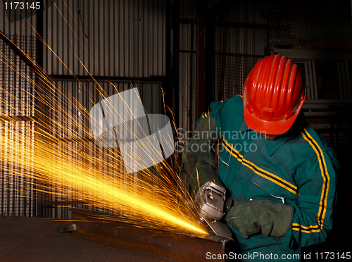 Image of heavy industry manual worker with grinder 03