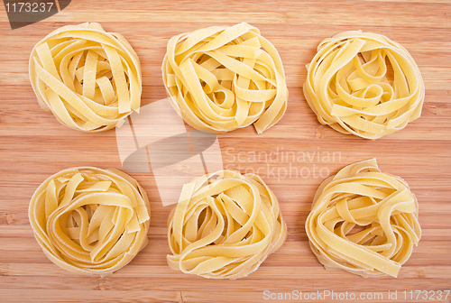 Image of Tagliatelle on the wooden background