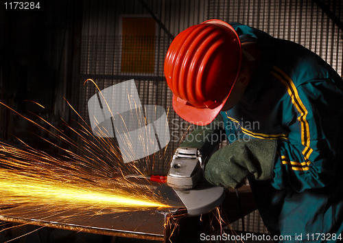 Image of heavy industry manual worker with grinder 02