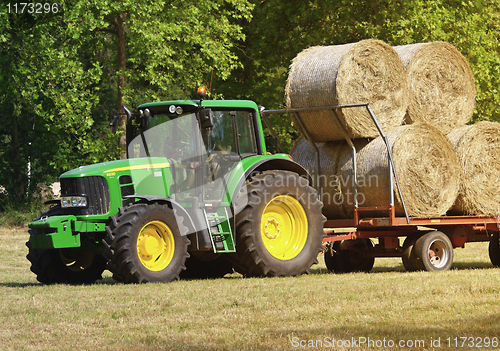 Image of green tractor at work