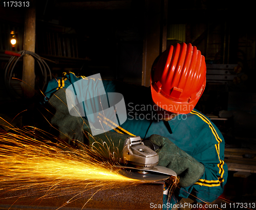 Image of heavy industry manual worker with grinder 01