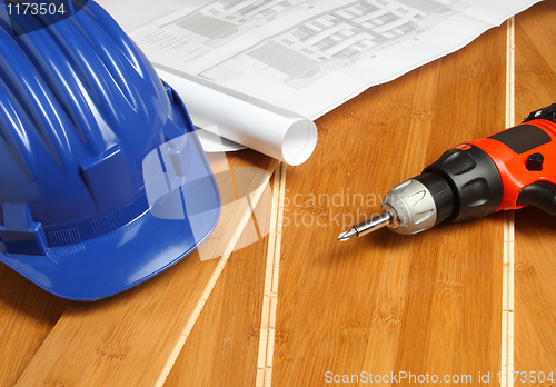 Image of blue helmet and red drill